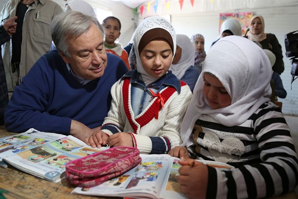 U.N. Secretary-General Antonio Guterres talks to Syrian refugees in a 4th grade classroom at the U.N.-run Zaatari refugee camp, in northern Jordan, March 28, 2017 (AP photo by Raad Adayleh).