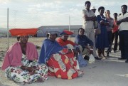 Herero women sit in a mile-long queue of voters in Katutura, Namibia, Nov. 7, 1989 (AP photo by Billy Paddock).