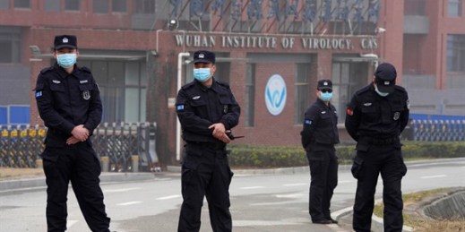 Security personnel gather near the entrance of the Wuhan Institute of Virology during a visit by the World Health Organization team in Wuhan, China, Feb. 3, 2021 (AP photo by Ng Han Guan).