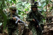 Soldiers patrol during a military operation in Macarena, southern Colombia