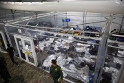 Young minors lie inside a pod at a detention center for unaccompanied children run by U.S. Customs and Border Protection in Donna, Texas, March 30, 2021 (AP photo by Dario Lopez-Mills).