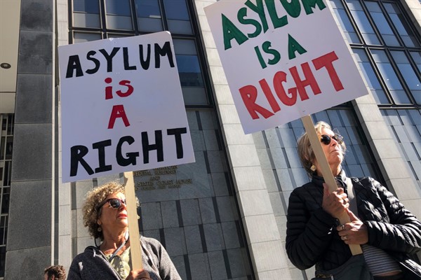 Protesters hold signs that read “Asylum is a Right” outside of the San Francisco Federal Courthouse, in San Francisco, California, July 24, 2019 (AP photo by Haven Daley).