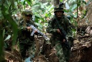 Soldiers patrol during a military operation in Macarena, southern Colombia, Feb. 20, 2010 (AP photo by Fernando Vergara).