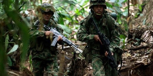 Soldiers patrol during a military operation in Macarena, southern Colombia, Feb. 20, 2010 (AP photo by Fernando Vergara).