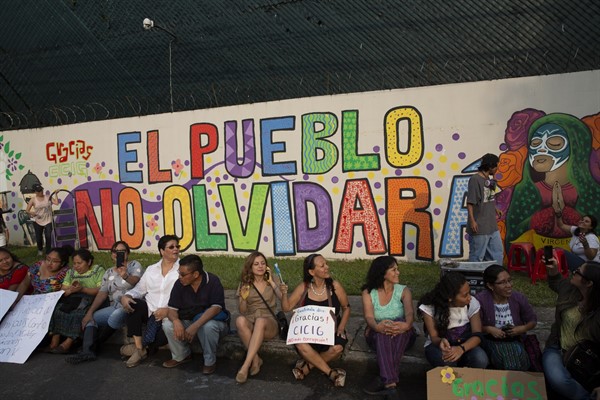 Artists and activists pose for photos next to a mural at the United Nations International Commission Against Impunity, CICIG, headquarters in Guatemala City, Saturday, Aug. 31, 2019 (AP photo by Moises Castillo).