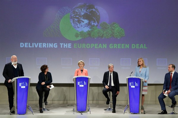 European Commission President Ursula von der Leyen, center, and other EU officials speak during a press conference at EU headquarters in Brussels, July 14, 2021 (AP photo by Valeria Mongelli).