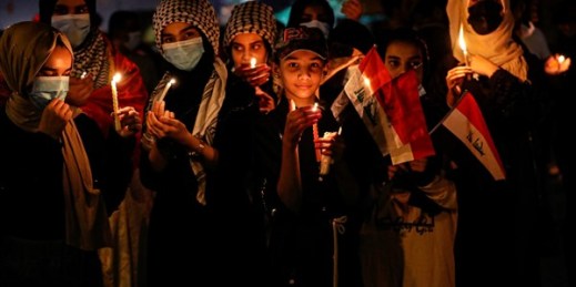 Demonstrators light candles to mark the first anniversary of the anti-government protests in Basra, Iraq, Oct. 1, 2020 (AP photo by Nabil al-Jurani).