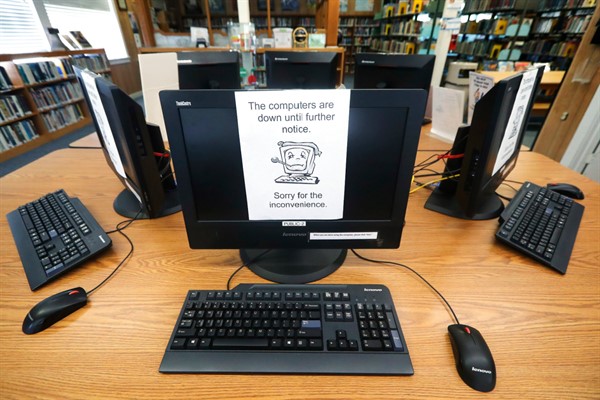 Signs on a bank of computers at the public library in Wilmer, Texas, tell visitors that the machines are not working, following a ransomware attack on local Texas governments’ networks, Aug. 22, 2019 (AP photo by Tony Gutierrez).