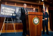 U.S. Senator Sheldon Whitehouse, left, speaks at a press conference to introduce the Cybercrime Prevention Act in Washington, June 17, 2021 (SIPA photo by Michael Brochstein via AP).