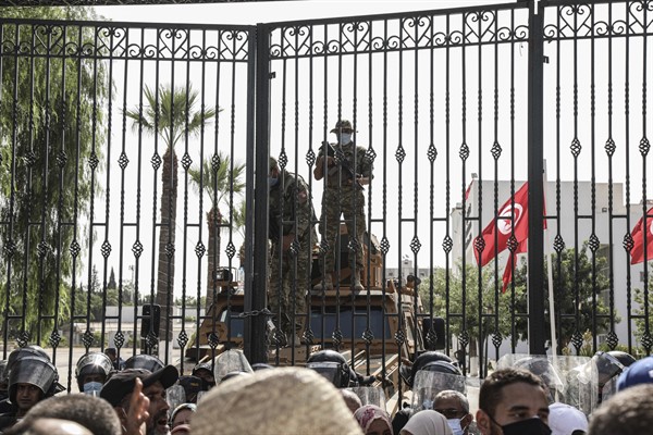 Soldiers of the Tunisian army guard the entrance of the parliament building during a protest a day after Tunisian President Kais Saied fired the prime minister and suspended the parliament, July 26, 2021 (AP photo by Khaled Nasraoui).