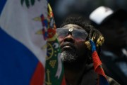 A man attends the funeral of slain President Jovenel Moise in Cap-Haitien, Haiti,  July 23, 2021 (AP photo/Matias Delacroix).