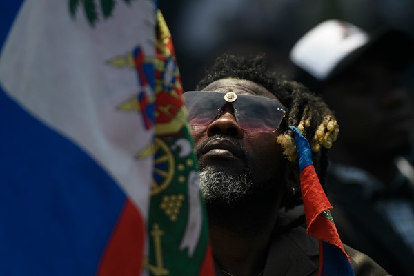 A man attends the funeral of slain President Jovenel Moise in Cap-Haitien, Haiti,  July 23, 2021 (AP photo/Matias Delacroix).