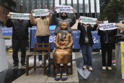 Protesters hold a rally to mark the March First Independence Movement against Japanese colonial rule by a statue symbolizing a wartime “comfort woman” near the Japanese Embassy in Seoul, South Korea, March 1, 2021 (AP photo by Ahn Young-joon).