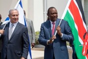 Former Israeli Prime Minister Benjamin Netanyahu and Kenyan President Uhuru Kenyatta hold the flags of their countries after a meeting in Nairobi, Kenya, July 5, 2016 (AP photo by Sayyid Abdul Azim).