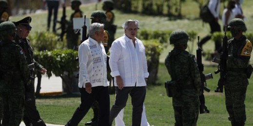 Mexican President Andres Manuel Lopez Obrador, center left, with Argentine President Alberto Fernandez in Iguala, Mexico, Feb. 24, 2021 (AP photo by Eduardo Verdugo).