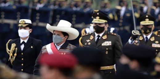 Peruvian President Pedro Castillo reviews the honor guard as he arrives for a military parade in Lima, Peru, July 30, 2021 (AP photo by Guadalupe Pardo).