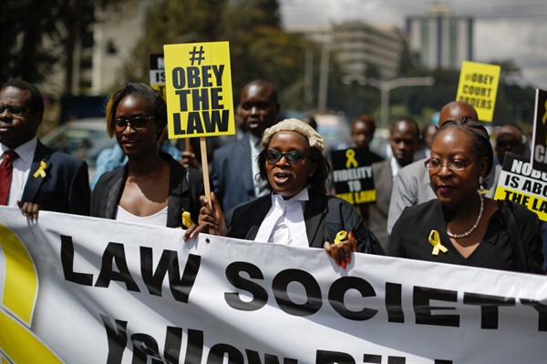 Mercy Wambua, center, the CEO of the Law Society of Kenya and other lawyers march to protest the Kenyan government’s deportation of an opposition politician, Feb. 15, 2018 (AP photo by Ben Curtis).