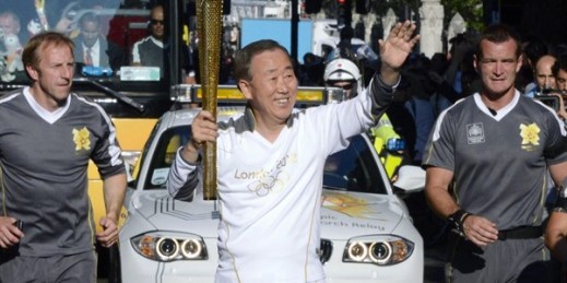 U.N. Secretary-General Ban Ki Moon takes part in the Olympic torch relay in London on July 26, 2012 (Kyodo via AP images).