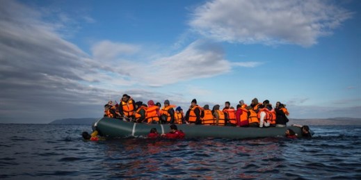 Refugees and migrants arrive on an inflatable vessel from the Turkish coast to the northeastern Greek island of Lesbos, Dec. 3, 2015 (AP photo by Santi Palacios).