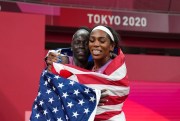 Athing Mu, of the United States, celebrates after winning the gold medal in the women’s 800-meter final, with bronze medalist Raevyn Rogers, right, also of the U.S., at the 2020 Summer Olympics in Tokyo, Aug. 3, 2021 (AP Photo by Matthias Schrader).