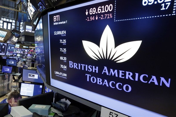 A logo for British American Tobacco on a trading post on the floor of the New York Stock Exchange, July 24, 2017 (AP photo by Richard Drew).
