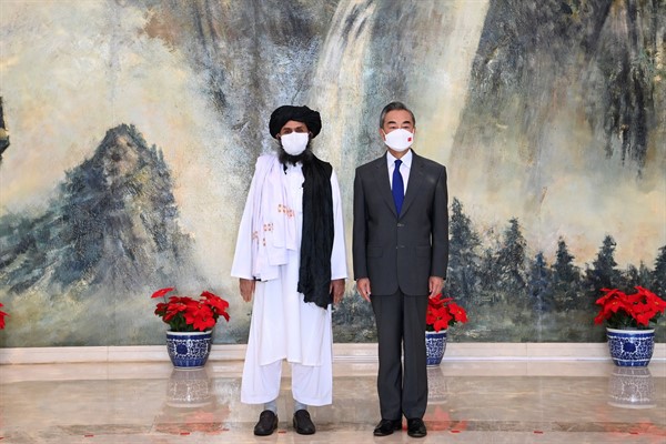 Chinese Foreign Minister Wang Yi with Mullah Abdul Ghani Baradar, then head of the Taliban’s political office, in Tianjin, China, July 28, 2021 (photo by Ministry of Foreign Affairs of China).
