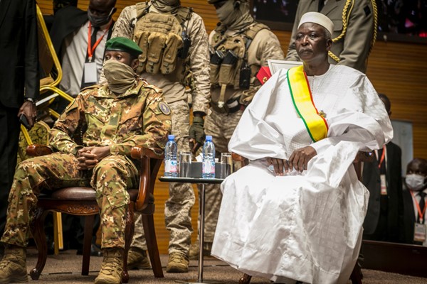 Col. Assimi Goita, left, head of Mali’s military junta, and retired Col. Maj. Bah N’Daw, right, as N’Daw is sworn into the office of transitional president, Bamako, Mali, Sept. 25, 2020 (AP file photo).