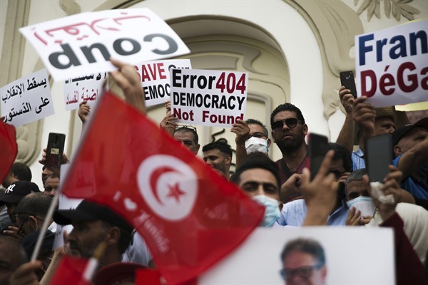 Tunisian demonstrators gather outside the Municipal Theater of Tunis during a protest against Tunisian President Kais Saied, Sept. 18, 2021 (AP photo by Riadh Dridi).