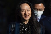 Meng Wanzhou, chief financial officer of Huawei, smiles as she leaves her home in Vancouver, Canada, Sept. 24, 2021 (AP photo by Darryl Dyck).