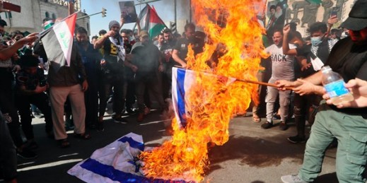 Protesters burn representations of Israeli flags during a demonstration in support of Palestinians in Gaza, Baghdad, Iraq, May 15, 2021 (AP photo by Khalid Mohammed).