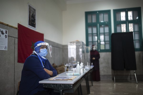 Election officials wait for voters inside a polling station, in Rabat, Morocco, Sept. 8, 2021 (AP photo by Mosa’ab Elshamy).