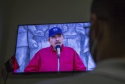 A man watches a televised national address by Nicaraguan President Daniel Ortega, Managua, Nicaragua, June 23, 2021 (AP photo by Miguel Andres).