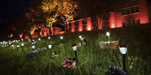 Shoes are placed outside the former Kamloops Indian Residential School to honor the 215 children whose unmarked graves were discovered near the facility, in Kamloops, British Columbia, June 4, 2021 (Photo by Darryl Dyck for the Canadian Press via AP).