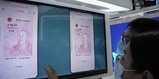 A digital version of the Chinese yuan, the e-CNY, on display during a trade fair in Beijing, Sept. 5, 2021 (AP photo by Ng Han Guan).