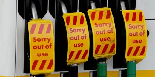 Closed fuel pumps at a gasoline station in London, Sept. 28, 2021 (AP photo by Frank Augstein).