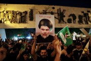 Followers of Shiite cleric Moqtada al-Sadr celebrate after the announcement of the results of parliamentary elections, Baghdad, Iraq, Oct. 11, 2021 (AP photo by Khalid Mohammed).