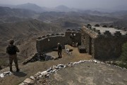 Pakistani troops observe the area from a hilltop post on the Pakistan-Afghanistan border, Khyber district, Pakistan, Aug. 3, 2021 (AP photo by Anjum Naveed).