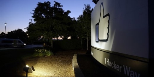 The Facebook “like” symbol is illuminated on a sign outside the company’s headquarters in Menlo Park, Calif, Jun 7, 2013 (AP photo by Marcio Jose Sanchez).