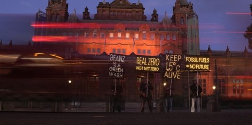 Climate activists hold up illuminated placards outside the Kelvingrove Art Gallery and Museum as the COP26 U.N. Climate Summit takes place in Glasgow, Scotland, Nov. 3, 2021 (AP photo by Alastair Grant).