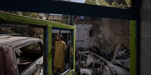 An Afghan inspects the damage at the Ahmadi family house after a U.S. drone strike killed Zemari Ahmadi and nine other family members on Aug. 29, Kabul, Afghanistan (AP file photo by Bernat Armangue).