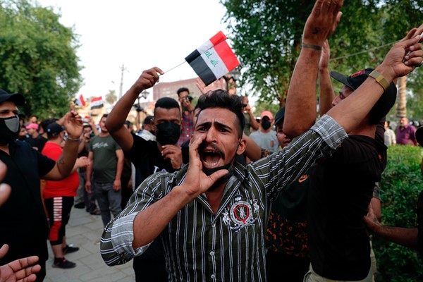 Demonstrators protest the Oct. 10 parliamentary vote outside the heavily fortified Green Zone, Baghdad, Iraq, Oct. 31, 2021 (AP Photo/Khalid Mohammed).