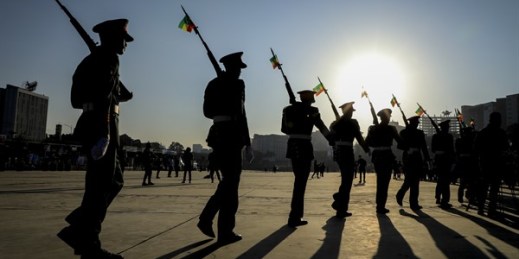 Ethiopian soldiers march with national flags attached to their rifles at a rally to show support for the Ethiopian armed forces, at Meskel square in downtown Addis Ababa, Nov. 7, 2021 (AP photo).