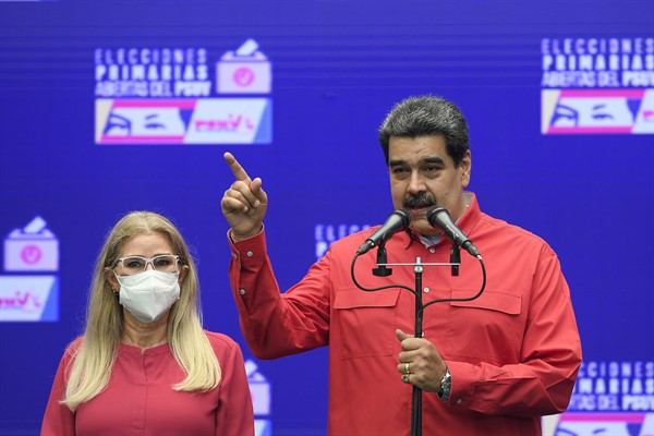 Venezuelan President Nicolas Maduro, accompanied by first lady Cilia Flores, speaks at a press conference after he voted in the ruling party’s primary elections, in Caracas, Venezuela, Aug. 8, 2021 (AP photo by Matias Delacroix).