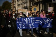 Young climate campaigners take part in a protest to coincide with the U.N. climate talks in Glasgow, in central London, Nov. 5, 2021 (AP photo by Matt Dunham).