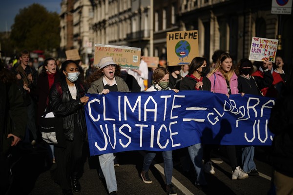 Young climate campaigners take part in a protest to coincide with the U.N. climate talks in Glasgow, in central London, Nov. 5, 2021 (AP photo by Matt Dunham).