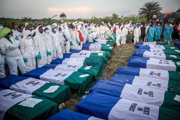 Coffins containing victims of a fuel tanker explosion seen lined up during a mass burial in Freetown, Sierra Leone (SIPA Images via AP).
