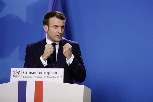 French President Emmanuel Macron speaks to the media at the conclusion of an EU summit in Brussels, Dec. 13, 2019 (AP photo by Olivier Matthys).