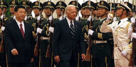 Then-U.S. Vice President Joseph Biden and then-Chinese Vice President Xi Jinping inspect a guard of honor during a welcome ceremony at the Great Hall of the People, Beijing, Aug. 18, 2011 (AP photo by Ng Han Guan).