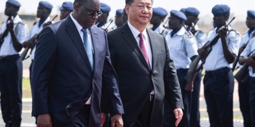 Senegalese President Macky Sall, left, and Chinese President Xi Jinping, inspect the honor guard during a state visit in Dakar, Senegal, July 21, 2018 (AP photo by Xaume Olleros).