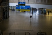 A man walks through a deserted part of Johannesburg’s airport, South Africa, Nov. 29, 2021 (AP photo by Jerome Delay).